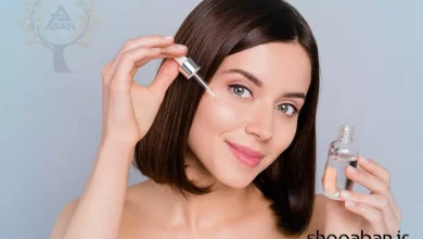 سرم صورت برای پوست چرب - بطری سرم نیاسینامید روی پس‌زمینه مات